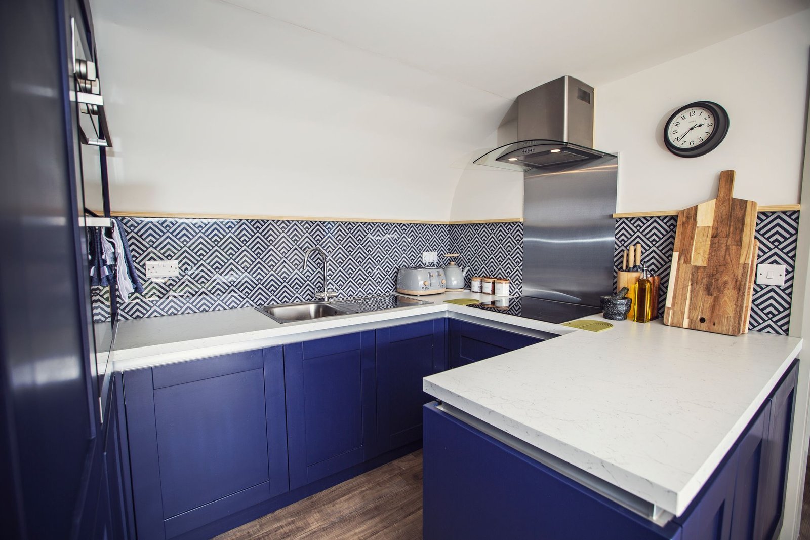 Blue fitted kitchen inside The Meadow